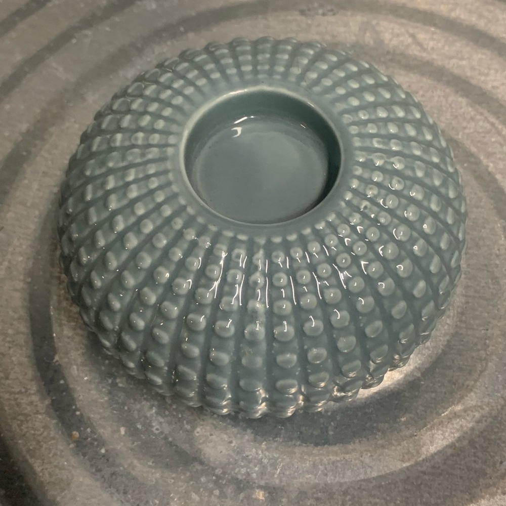 Sea urchin ceramic votive candle holder in a beautiful sage blue color.